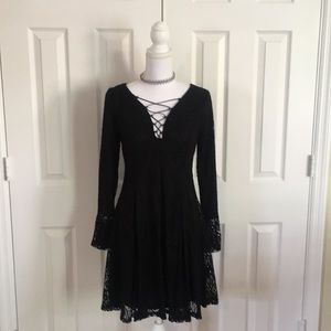 Lace overlay dress with lace up neckline.